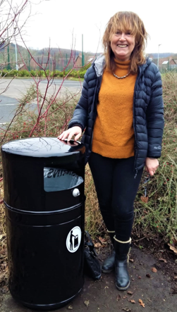Councillor Jules Wood with new litter bin at Malvern Vale car park